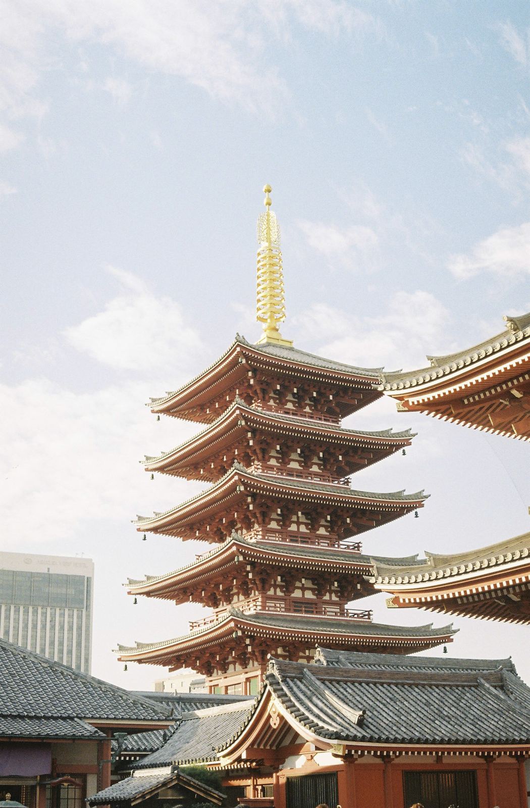 Five-storey pagoda at Sensō-ji against a bright sky.